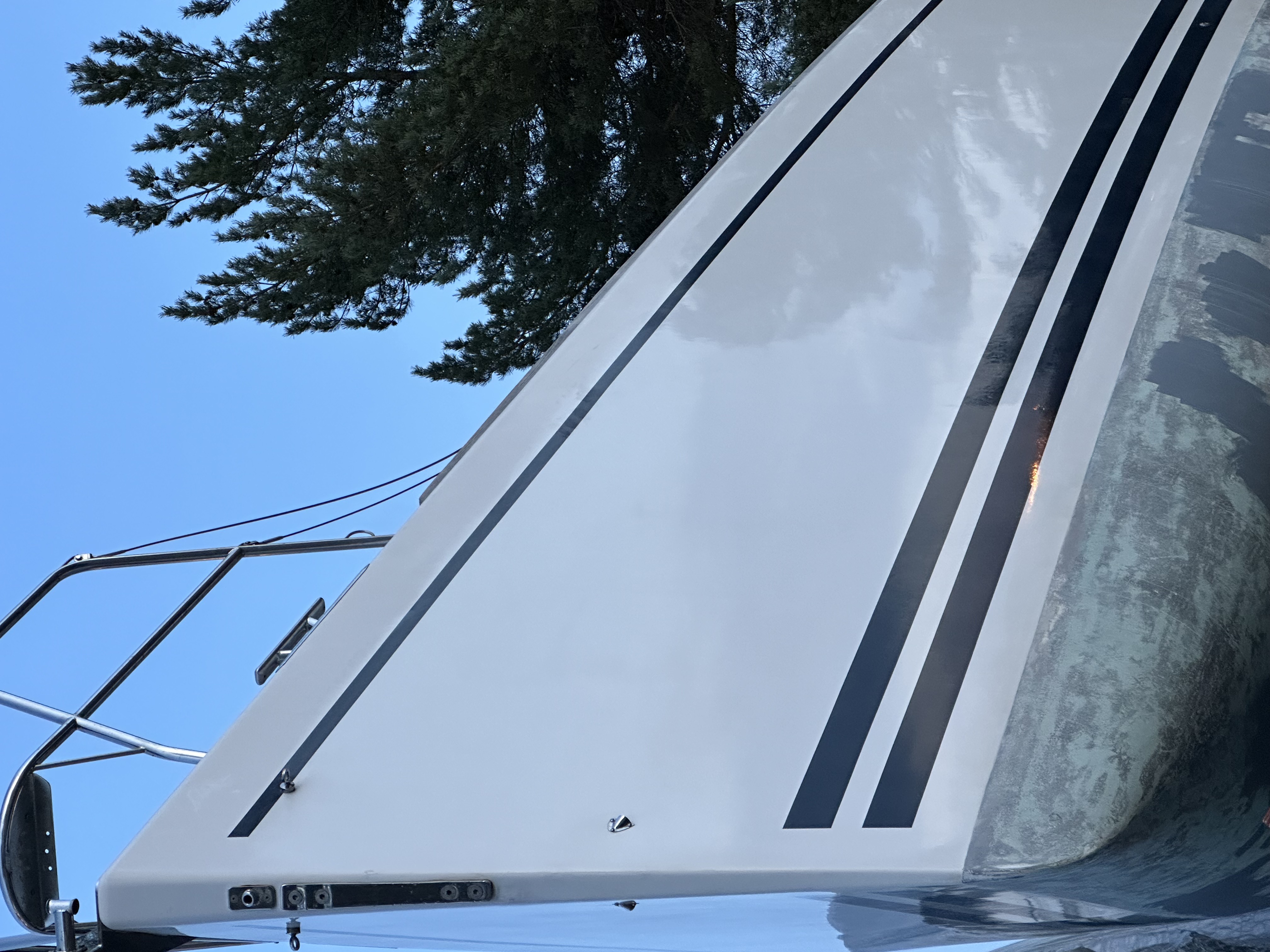 Iris in the yard — topsides polished, ready for her last day on land