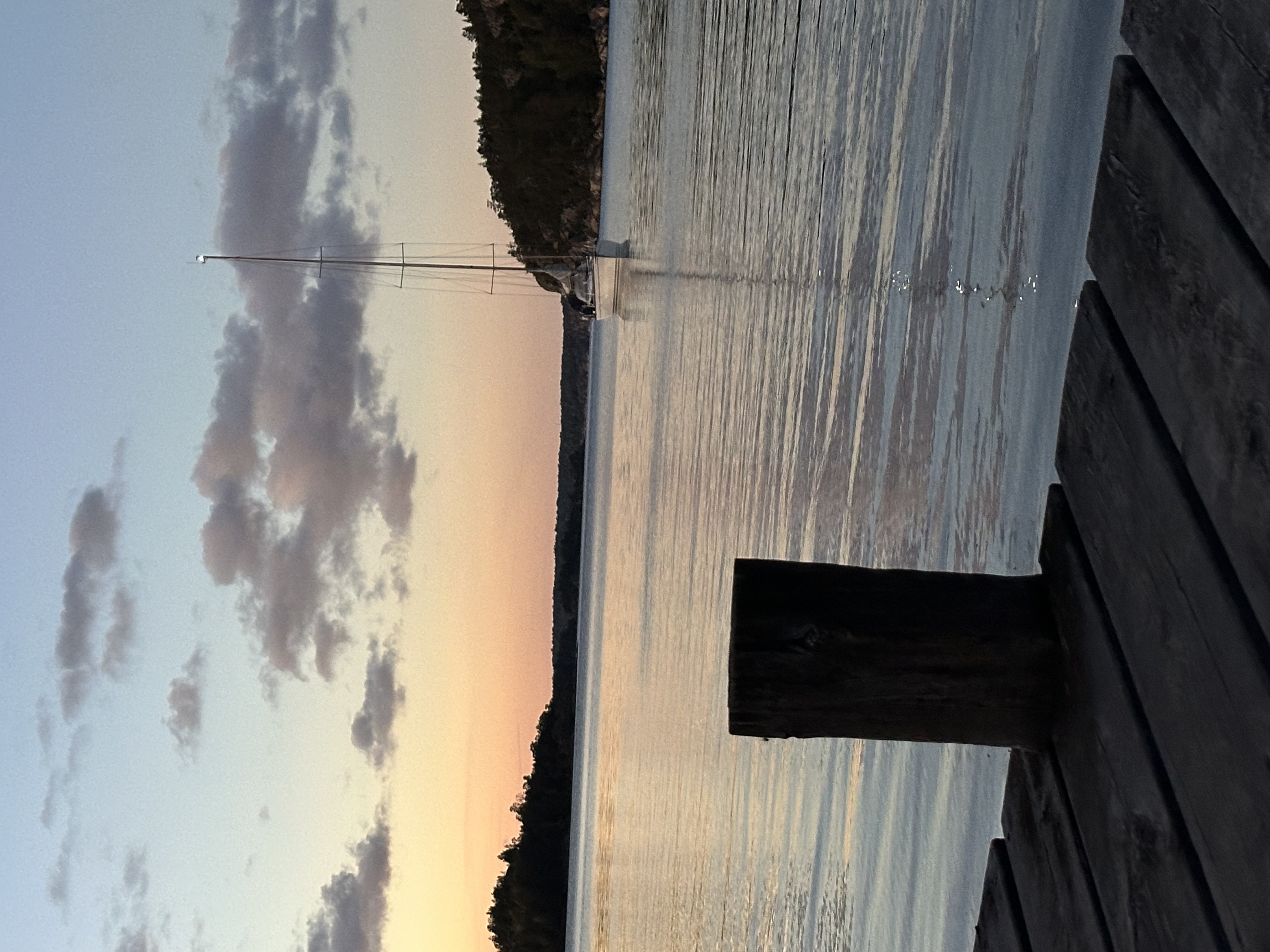 The dock at Härsö as the sun drops behind the trees